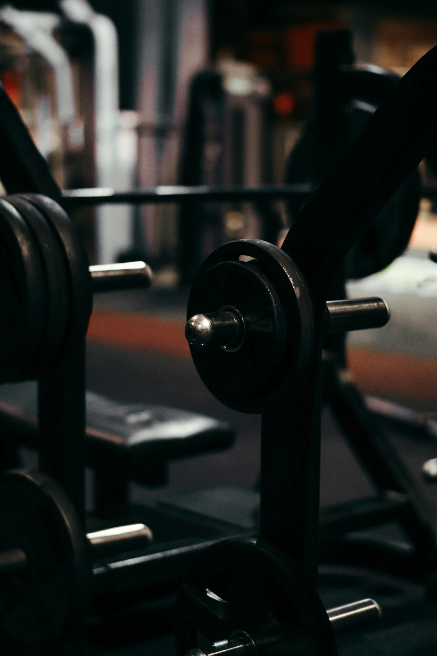 An up-close view of weightlifting equipment in a modern gym setting, perfect for fitness enthusiasts.